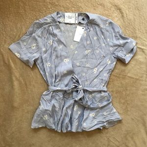 L’Acadmie REVOLVE short sleeve wrap top daisy